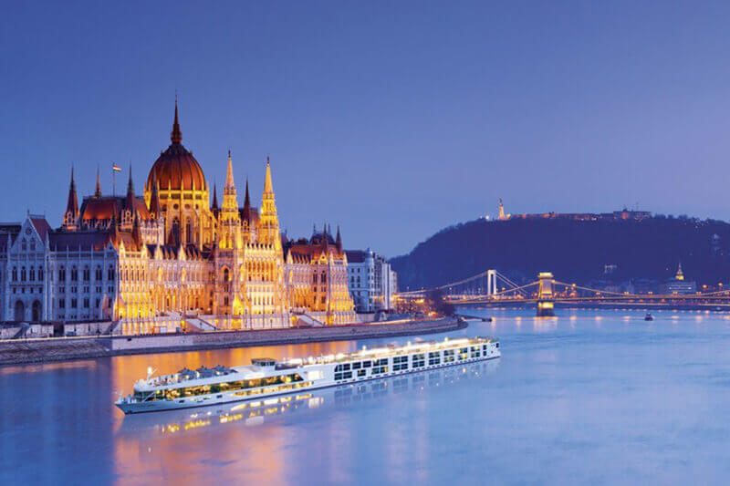 Budapest Parliament on the Danube at dusk