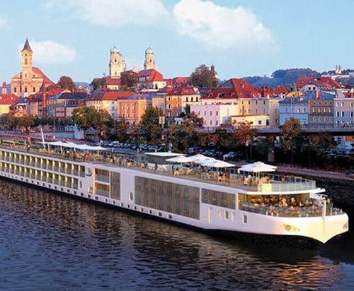 River ship by a historic town